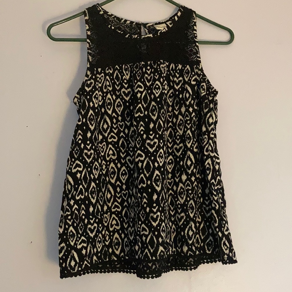 Black and white tank top with lace detailing.